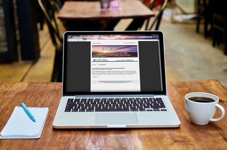 Laptop, notebook and a cup