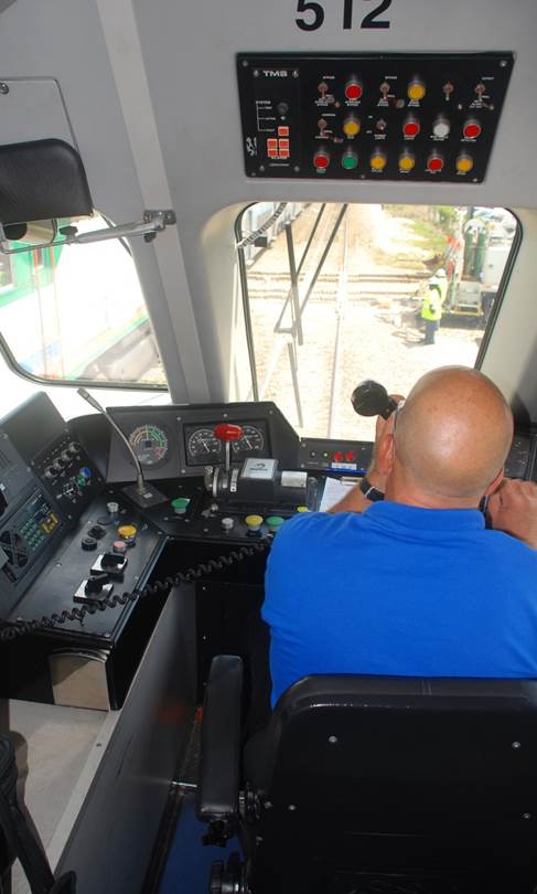 A conductor operating a train.